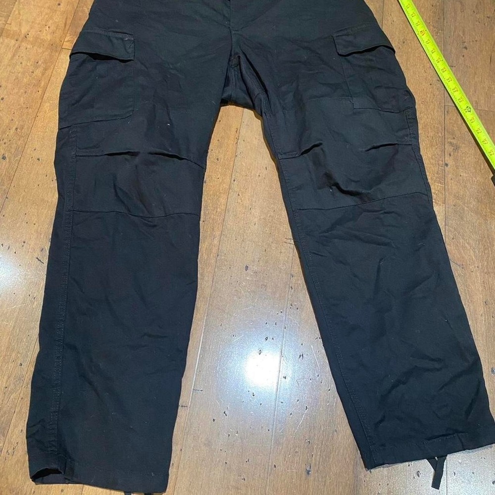 Black cargo pants with‎ adjustable waist and leg openings